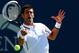 NEW YORK, NY - AUGUST 28: Novak Djokovic of Serbia returns a shot against Paul-Henri Mathieu of France during their men's second round match on Day Four of the 2014 US Open at the USTA Billie Jean King National Tennis Center on August 28, 2014 in the Flu