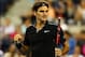 NEW YORK, NY - AUGUST 26: Roger Federer of Switzerland reacts against Marinko Matosevic of Australia during their men's singles first round match on Day Two of the 2014 US Open at the USTA Billie Jean King National Tennis Center on August 26, 2014 in th
