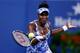 NEW YORK, NY - AUGUST 27: Venus Williams of the United States returns a shot against Timea Bacsinszky of Switzerland during their women's singles secound round match on Day Three of the 2014 US Open at the USTA Billie Jean King National Tennis Center on