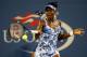 NEW YORK, NY - AUGUST 27: Venus Williams of the United States returns a shot against Timea Bacsinszky of Switzerland during their women's singles secound round match on Day Three of the 2014 US Open at the USTA Billie Jean King National Tennis Center on