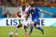 RECIFE, BRAZIL - JUNE 29: Joel Campbell of Costa Rica and Sokratis Papastathopoulos of Greece compete for the ball during the 2014 FIFA World Cup Brazil Round of 16 match between Costa Rica and Greece at Arena Pernambuco on June 29, 2014 in Recife, Brazi