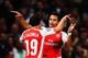 LONDON, ENGLAND - AUGUST 27: Alexis Sanchez (R) of Arsenal celebrates with team mate Santi Cazorla of Arsenal after scoring during the UEFA Champions League Qualifier 2nd leg match between Arsenal and Besiktas at the Emirates Stadium on August 27, 2014 i