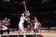 WASHINGTON, DC - APRIL 12: John Henson #31 of the Milwaukee Bucks shoots against the Washington Wizards during the game at the Verizon Center on April 12, 2014 in Washington, DC. NOTE TO USER: User expressly acknowledges and agrees that, by downloading an