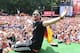 BERLIN, GERMANY - JULY 15: Benedikt Hoewedes celebrates during the German team victory ceremony on July 15, 2014 in Berlin, Germany. Germany won the 2014 FIFA World Cup Brazil match against Argentina in Rio de Janeiro on July 13. (Photo by Markus Gilliar
