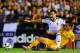 VALENCIA, SPAIN - AUGUST 29: Javi Fuego (L) of Valencia competes for the ball with Juanmi of Malaga during the La Liga match between Valencia CF and Malaga CF at Estadi de Mestalla on August 29, 2014 in Valencia, Spain. (Photo by Manuel Queimadelos Alon