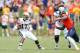 CHARLOTTESVILLE, VA - AUGUST 30: Brett Hundley #17 of the UCLA Bruins looks to evade pressure from Eli Harold #7 of the Virginia Cavaliers during first half action at Scott Stadium on August 30, 2014 in Charlottesville, Virginia. (Photo by Joe Robbins/Get