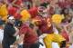 Cody Kessler and Steve Sarkisian celebrate a touchdown.