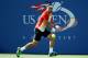 NEW YORK, NY - AUGUST 26: David Ferrer of Spain returns a shot to Damir Dzumhur of Bosnia and Herzegovina during his men's singles first round match on Day Two of the 2014 US Open at the USTA Billie Jean King National Tennis Center on August 26, 2014 in