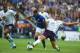 LEICESTER, ENGLAND - AUGUST 16: Phil Jagielka of Everton tackles Riyad Mahrez of Leicester City watched by Sylvain Distin of Everton during the Barclays Premier League match between Leicester City and Everton at the King Power Stadium on August 16, 2014 i