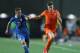 PETAH TIQWA, ISRAEL - JUNE 15: Fausto Rossi of Italy tries to tackle Marco Van Ginkel of the Netherlands during the UEFA European U21 Championships semi- final match between Italy and the Netherlands at Ha Moshava Stadium on June 15, 2013 in Petah Tiqwa,