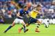 LEICESTER, ENGLAND - AUGUST 31: Alexis Sanchez of Arsenal goes past Andy King of Leicester City during the Barclays Premier League match between Leicester City and Arsenal at The King Power Stadium on August 31, 2014 in Leicester, England. (Photo by Lau