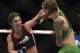 Apr 26, 2014; Baltimore, MD, USA; Bethe Correia (left) lands a head shot on Jessamyn Duke during the second round in UFC 172 at Baltimore Arena. Correia defeated Duke by judges decision. Mandatory Credit: Tommy Gilligan-USA TODAY Sports