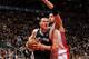 TORONTO, CANADA - December 10: Aron Baynes #16 of the San Antonio Spurs drives to the basket against Jonas Valanciunas #17 of the Toronto Raptors on December 10, 2013 at the Air Canada Centre in Toronto, Ontario, Canada. NOTE TO USER: User expressly ack
