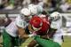 Aug 30, 2014; Eugene, OR, USA; Oregon Ducks defensive lineman Alex Balducci (56), linebacker Torrodney Prevot (86) and defensive lineman DeForest Buckner (44) tackle South Dakota Coyotes running back Trevor Bouma (21) at Autzen Stadium. Mandatory Credit: