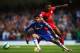 LONDON, ENGLAND - AUGUST 23: Diego Costa of Chelsea holds off Liam Moore of Leicester City during the Barclays Premier League match between Chelsea and Leicester City at Stamford Bridge on August 23, 2014 in London, England. (Photo by Paul Gilham/Getty