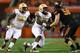 ARLINGTON, TX - AUGUST 30: Mario Edwards Jr. #15 and Eddie Goldman #90 of the Florida State Seminoles rush as Daniel Koenig #58 of the Oklahoma State Cowboys blocks in the first half of the Advocare Cowboys Classic at AT&T Stadium on August 30, 2014 in A