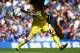 LONDON, ENGLAND - AUGUST 23: Thibaut Courtois of Chelsea rolls the ball out during the Barclays Premier League match between Chelsea and Leicester City at Stamford Bridge on August 23, 2014 in London, England. (Photo by Paul Gilham/Getty Images)