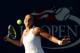 NEW YORK, NY - AUGUST 28: Kaia Kanepi of Estonia returns a shot against Samantha Stosur of Australia on Day Four of the 2014 US Open at the USTA Billie Jean King National Tennis Center on August 28, 2014 in the Flushing neighborhood of the Queens boroug