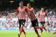 LONDON, ENGLAND - AUGUST 30: Morgan Schneiderlin of Southampton celebrates scoring his opening goal with Maya Yoshida of Southampton during the Barclays Premier League match between West Ham United and Southampton at Boleyn Ground on August 30, 2014 in Lo