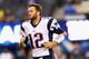EAST RUTHERFORD, NJ - AUGUST 28: Tom Brady #12 of the New England Patriots runs onto the field before the preseason game against the New York Giants at MetLife Stadium on August 28, 2014 in East Rutherford, New Jersey. (Photo by Jeff Zelevansky/Getty Im