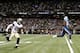 NEW ORLEANS, LA - AUGUST 15: Justin Hunter #15 of the Tennessee Titans runs in a pass for a touchdown in front of Rafael Bush #25 of the New Orleans Saints during a preseason game at the Mercedes-Benz Superdome on August 15, 2014 in New Orleans, Louisian