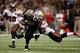 NEW ORLEANS, LA - DECEMBER 16: Marques Colston #12 of the New Orleans Saints slips a tackle by Lavonte David #54 of the Tampa Bay Buccaneers at the Mercedes-Benz Superdome on December 16, 2012 in New Orleans, Louisiana. (Photo by Chris Graythen/Getty