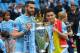 MANCHESTER, ENGLAND - MAY 11: Alvaro Negredo of Manchester City and Jesus Navas (R) pose with the trophy at the end of the Barclays Premier League match between Manchester City and West Ham United at the Etihad Stadium on May 11, 2014 in Manchester, Engl