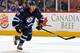 WINNIPEG, MB - JANUARY 25: Devin Setoguchi #40 of the Winnipeg Jets follows the play down the ice during third period action against the Toronto Maple Leafs at the MTS Centre on January 25, 2014 in Winnipeg, Manitoba, Canada. The Jets defeated the Leafs 5
