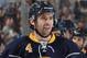 BUFFALO, NY - APRIL 13: Jamie McBain #4 of the Buffalo Sabres celebrates his first period goal against the New York Islanders at First Niagara Center on April 13, 2014 in Buffalo, New York. (Photo by Jen Fuller/Getty Images)