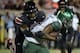 Sep 1, 2014; Louisville, KY, USA; Louisville Cardinals linebacker James Burgess (13) tackles Miami Hurricanes running back Duke Johnson (8) during the second half of play at Papa John's Cardinal Stadium. Louisville defeated Miami 31-13. Mandatory Credit: