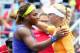 MONTREAL, QC - AUGUST 08: (L-R)Serena Williams of the USA hugs Caroline Wozniacki of Denmark after their quarterfinal match during the Rogers Cup at Uniprix Stadium on August 8, 2014 in Montreal, Canada. (Photo by Streeter Lecka/Getty Images)