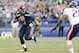 Aug 22, 2014; Seattle, WA, USA; Seattle Seahawks quarterback Russell Wilson (3) scrambles with the ball during the first quarter against the Chicago Bears at CenturyLink Field. Mandatory Credit: Steven Bisig-USA TODAY Sports