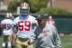 Defensive coordinator Vic Fangio (right) has spent plenty of time working with Lynch (left) to build up his strength.