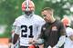 Jul 26, 2014; Berea, OH, USA; Cleveland Browns cornerback Justin Gilbert (21) and defensive coordinator Jim O'neil during training camp at the Cleveland Browns training facility. Mandatory Credit: Ken Blaze-USA TODAY Sports