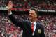 MANCHESTER, ENGLAND - AUGUST 16: Manchester United Manager Louis van Gaal waves to the crowd prior to the Barclays Premier League match between Manchester United and Swansea City at Old Trafford on August 16, 2014 in Manchester, England. (Photo by Alex