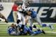 DETROIT, MI - AUGUST 22: Toby Gerhart #21 of the Jacksonville Jaguars tries to break the tackle by Devin Taylor #92 of the Detroit Lions in the first quarter during a preseason game at Ford Field on August 22, 2014 in Detroit, Michigan. (Photo by Leon Hal