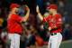 BOSTON, MA - AUGUST 18: Albert Pujols #5 and Mike Trout #27 of the Los Angeles Angels celebrate a 4-2 win over the Boston Red Sox at Fenway Park on August 18, 2014 in Boston, Massachusetts. (Photo by Jim Rogash/Getty Images)