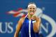 NEW YORK, NY - SEPTEMBER 01: Victoria Azarenka of Belarus celebrates winning a point against Aleksandra Krunic of Serbia on Day Eight of the 2014 US Open at the USTA Billie Jean King National Tennis Center on September 1, 2014 in the Flushing neighborhoo