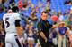 BALTIMORE, MD - AUGUST 07: Quarterback Joe Flacco #5 of the Baltimore Ravens talks with offensive coordinator Gary Kubiak before the start of their game against the San Francisco 49ers durng an NFL pre-season game at M&T Bank Stadium on August 7, 2014 in