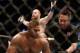 Aug 17, 2013; Boston, MA, USA; Travis Browne, rear, celebrates as the referee helps up Alistair Overeem during a UFC Heavyweight match at the TD Garden. Brown won by knockout in one round. Mandatory Credit: Winslow Townson-USA TODAY Sports
