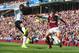BURNLEY, ENGLAND - AUGUST 30: Luis Antonio Valencia of Manchester United goes into to block Matthew Taylor of Burnley during the Barclays Premier League match between Burnley and Manchester United at Turf Moor on August 30, 2014 in Burnley, England. (Ph