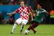 RECIFE, BRAZIL - JUNE 23: Ivan Rakitic of Croatia and Jose Juan Vazquez of Mexico compete for the ball during the 2014 FIFA World Cup Brazil Group A match between Croatia and Mexico at Arena Pernambuco on June 23, 2014 in Recife, Brazil. (Photo by Micha