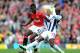 MANCHESTER, ENGLAND - MARCH 11: Paul Pogba of Manchester United is challenged by Marc-Antoine Fortune of West Bromwich Albionduring the Barclays Premier League match between Manchester United and West Bromwich Albion at Old Trafford on March 11, 2012 in