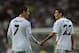 MADRID, SPAIN - OCTOBER 02: Angel Di Maria (R) of Real Madrid CF celebrates with team-mate Cristiano Ronaldo after scoring their team's third goal during the UEFA Champions League match between Real Madrid CF and FC Copenhagen at Estadio Santiago Bernab