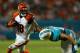 MIAMI GARDENS, FL - OCTOBER 31: A.J. Green #18 of the Cincinnati Bengals pushes off of Brent Grimes #21 of the Miami Dolphins during a game at Sun Life Stadium on October 31, 2013 in Miami Gardens, Florida. (Photo by Mike Ehrmann/Getty Images)