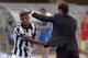 VERONA, ITALY - AUGUST 30: Head coach of Juventus Massimiliano Allegri (R) shakes hands with Kingsley Coman during the Serie A match between AC Chievo Verona and Juventus FC at Stadio Marc'Antonio Bentegodi on August 30, 2014 in Verona, Italy. (Photo b