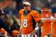 ARLINGTON, TX - AUGUST 28: Peyton Manning #18 of the Denver Broncos watches from the sidelines against the Dallas Cowboys in the first half of their preseason game at AT&T Stadium on August 28, 2014 in Arlington, Texas. (Photo by Ronald Martinez/Getty