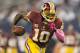 ARLINGTON, TX - OCTOBER 13: Robert Griffin III #10 of the Washington Redskins runs the ball against the Dallas Cowboys at AT&T Stadium on October 13, 2013 in Arlington, Texas. The Cowboys defeated the Redskins 31-16. (Photo by Wesley Hitt/Getty Images)