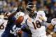 Oct 20, 2013; Indianapolis, IN, USA; Denver Broncos quarterback Peyton Manning (18) fumbles as he is hit by Indianapolis Colts outside linebacker Robert Mathis (98) during the first half at Lucas Oil Stadium. Mandatory Credit: Thomas J. Russo-USA TODAY Sp