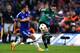 LONDON, ENGLAND - SEPTEMBER 17: Julian Draxler of Schalke crosses the ball as Eden Hazard of Chelsea closes in during the UEFA Champions League Group G match between Chelsea and FC Schalke 04 on September 17, 2014 in London, United Kingdom. (Photo by Mi